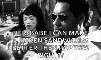 Man And Woman Eating Chicken Sandwiches GIF