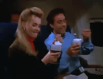 Man And Woman Eating Ice Cream On Plane GIF