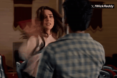 Man And Woman Fighting In Front Of 7Wick Reddy Sign GIF