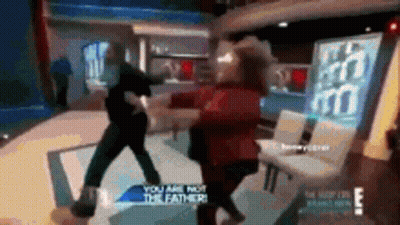 Man And Woman Fighting In Front Of You Are Not The Father Sign GIF