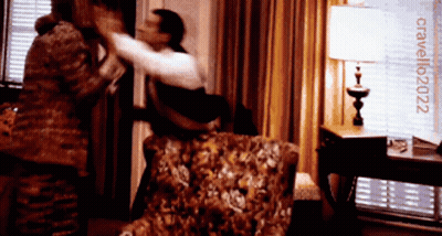 Man And Woman Fighting In Room With Cavallo2022 Sign GIF
