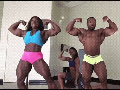 Man And Woman Flexing While Woman Watches GIF
