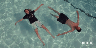 Man And Woman Floating In Pool Netflix GIF