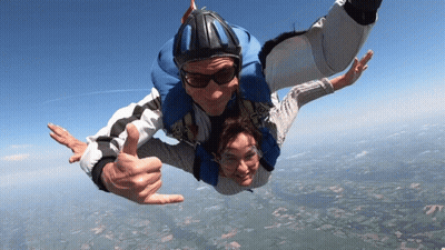 Man And Woman Flying Thumbs Up GIF