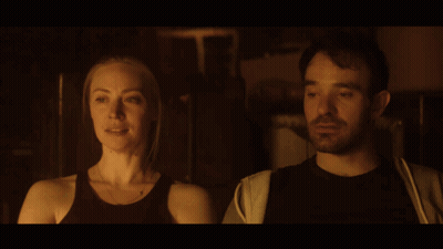 Man And Woman Gazing In Dark Room GIF