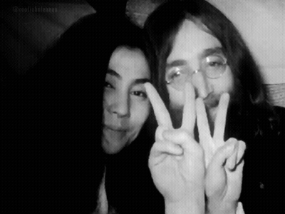 Man And Woman Giving Peace Sign GIF