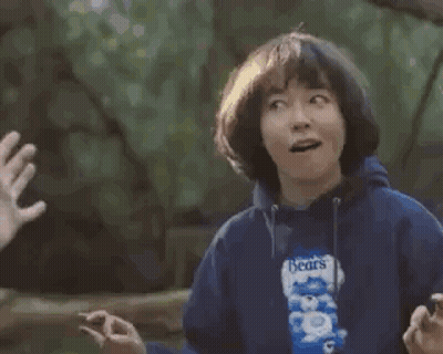 Man And Woman High-Fiving With Popcorn GIF