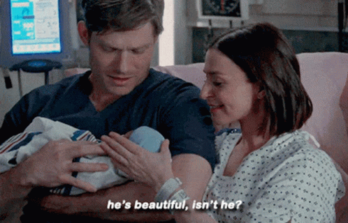Man And Woman Holding Baby In Hospital Saying He's Beautiful Isn't He GIF
