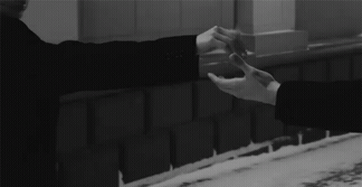 Man And Woman Holding Hands At Brick Wall GIF