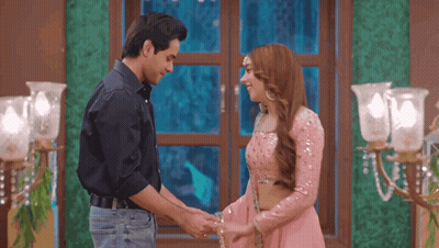 Man And Woman Holding Hands By Window GIF