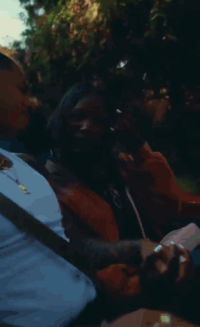 Man And Woman Holding Hands In Car Laughing GIF