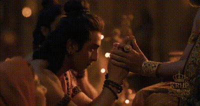 Man And Woman Holding Hands In Dark Room GIF