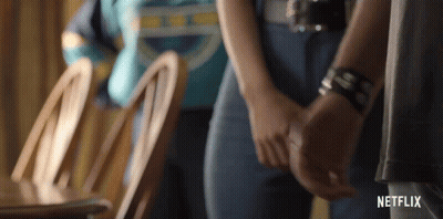 Man And Woman Holding Hands In Netflix Trailer GIF
