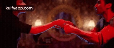 Man And Woman Holding Hands In Room GIF