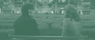 Man And Woman Holding Hands On Bench GIF