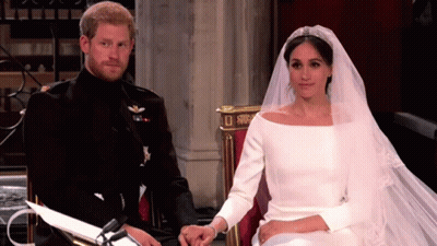 Man And Woman Holding Hands Sitting In Chair GIF