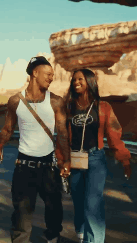 Man And Woman Holding Hands Walking In Desert GIF
