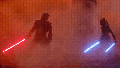 Man And Woman Holding Lightsabers GIF