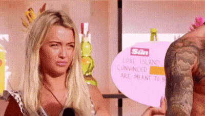 Man And Woman Holding Sign GIF