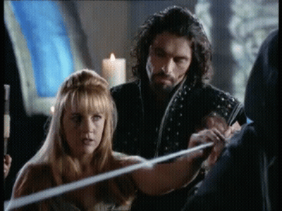 Man and Woman Holding Sword