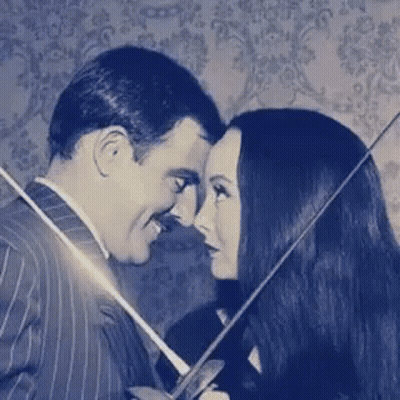Man And Woman Holding Sword GIF