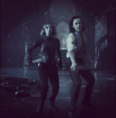 Man And Woman Holding Swords GIF