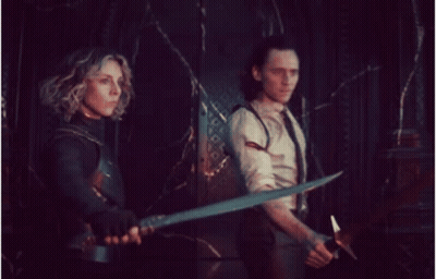Man And Woman Holding Swords In Dark Room GIF