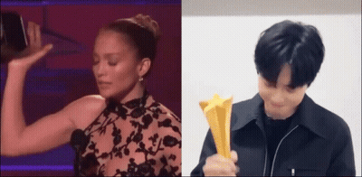 Man And Woman Holding Trophies On Stage GIF