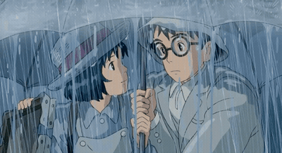 Man and Woman Holding Umbrellas in Rain