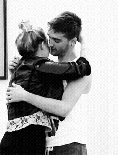 Man And Woman Hugging And Kissing In Black And White GIF