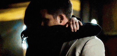 Man And Woman Hugging And Kissing In Dark Room GIF