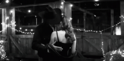 Man And Woman Hugging At Table GIF
