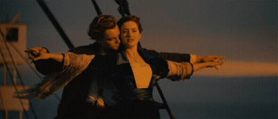 Man And Woman Hugging By Ocean GIF