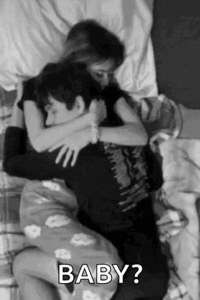 Man And Woman Hugging In Bed GIF