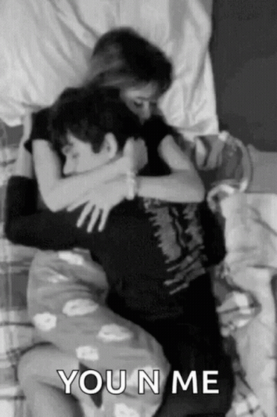 Man And Woman Hugging In Bed GIF