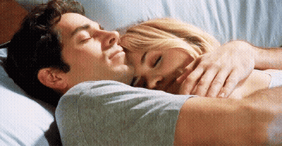 Man And Woman Hugging In Bed GIF
