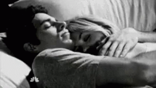 Man And Woman Hugging In Bed GIF