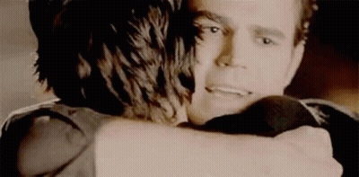 Man and Woman Hugging in Dark Room