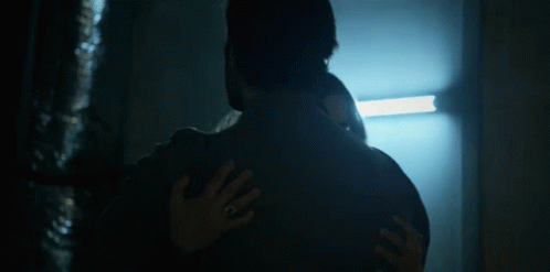 Man And Woman Hugging In Dark Room GIF