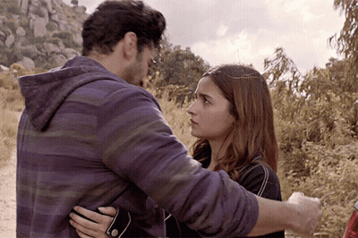 Man And Woman Hugging In Field GIF