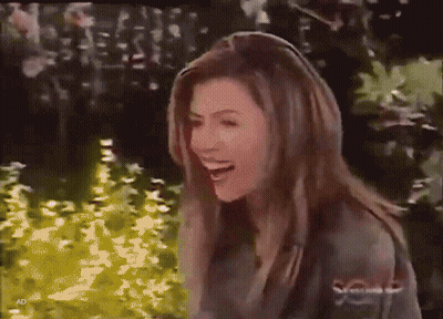 Man And Woman Hugging In Front Of Brick Wall GIF