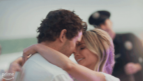 Man And Woman Hugging In Front Of Prime Sign GIF