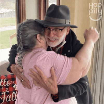 Man And Woman Hugging In Hallway GIF