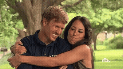 Man And Woman Hugging In Park With HGTV Shirt GIF
