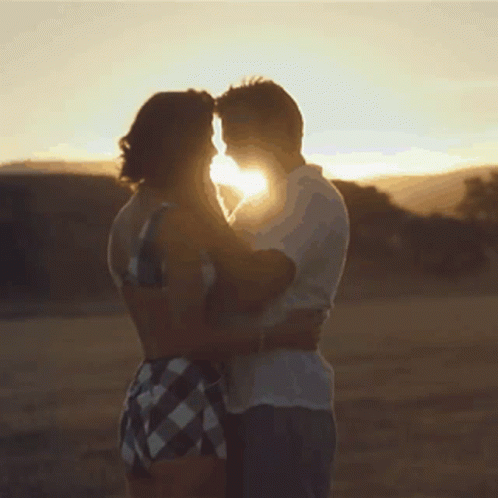 Man And Woman Hugging In Sunlight GIF