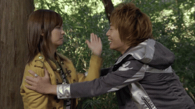 Man And Woman Hugging In Woods GIF