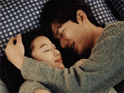 Man And Woman Hugging On Bed GIF