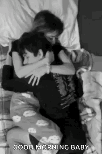 Man And Woman Hugging On Bed GIF