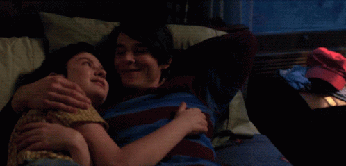 Man And Woman Hugging On Bed GIF