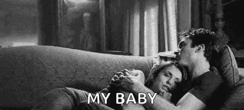 Man And Woman Hugging On Couch GIF